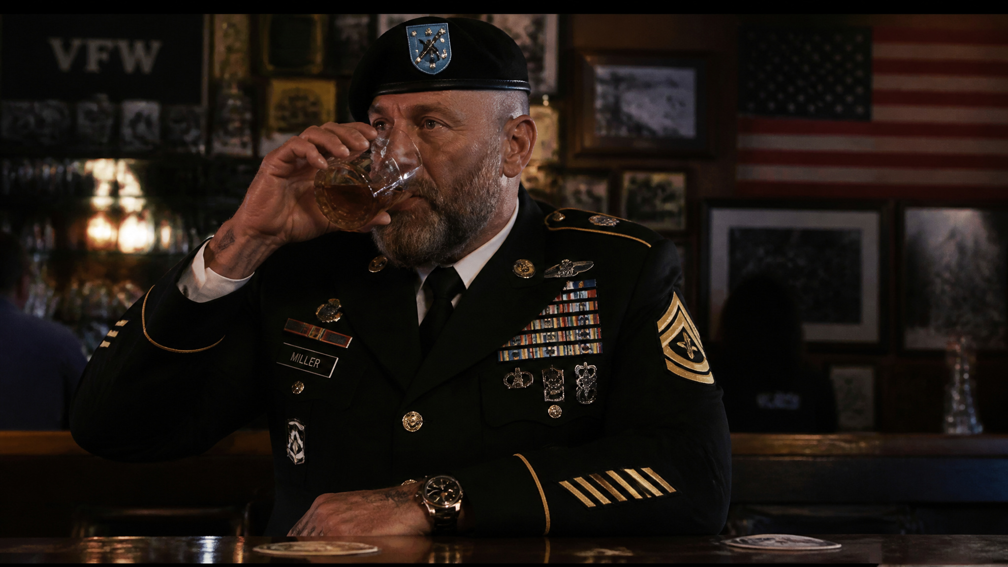 Service member in uniform drinking, a warning sign of a drinking problem
